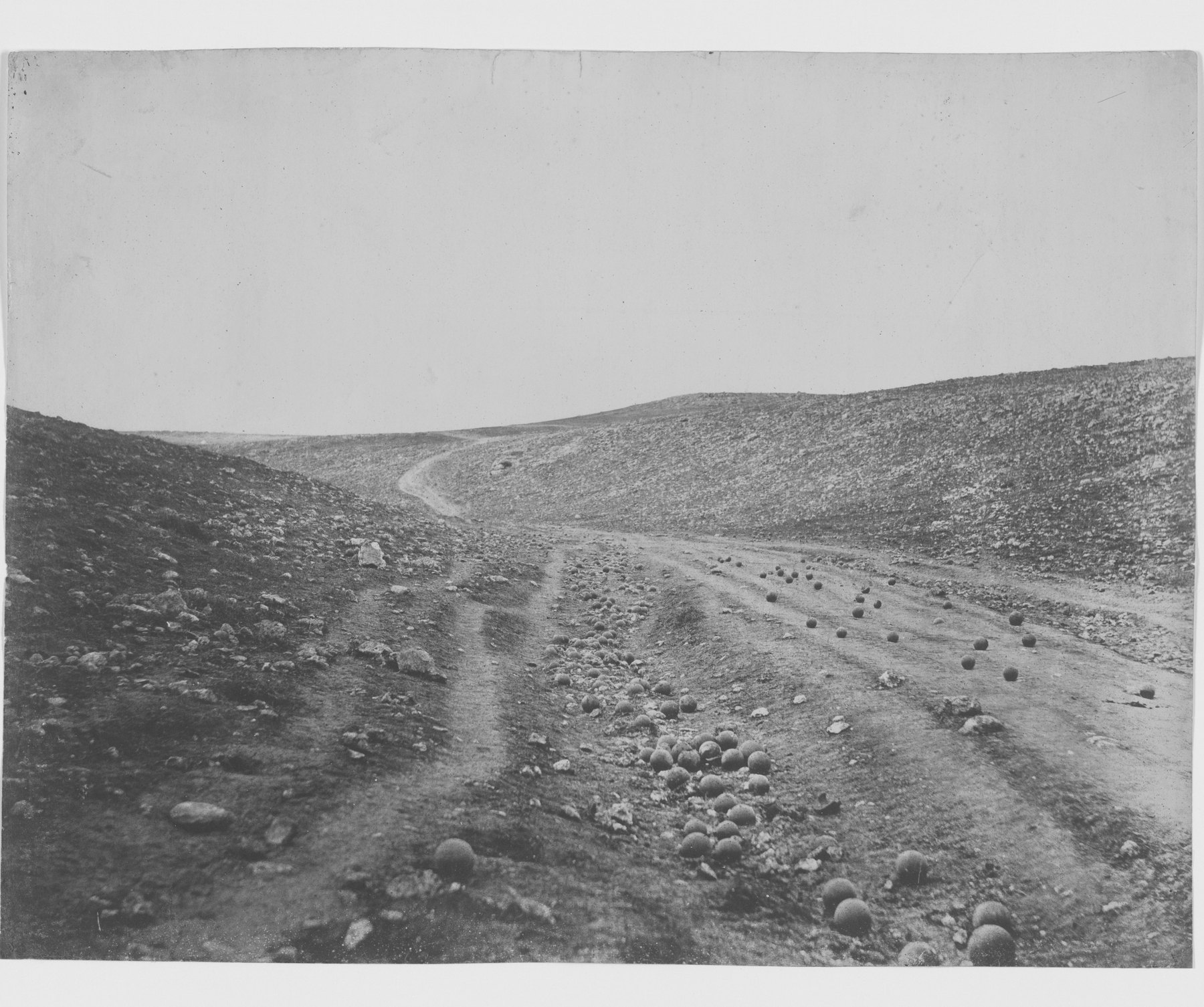 Roger Fenton’s “The Valley of the Shadow of Death,” a ravine near Sevastopol strewn with Russian round shot, photographed in 1855. It is not the valley of the charge. (Roger Fenton, 1855. Library of Congress, public domain)